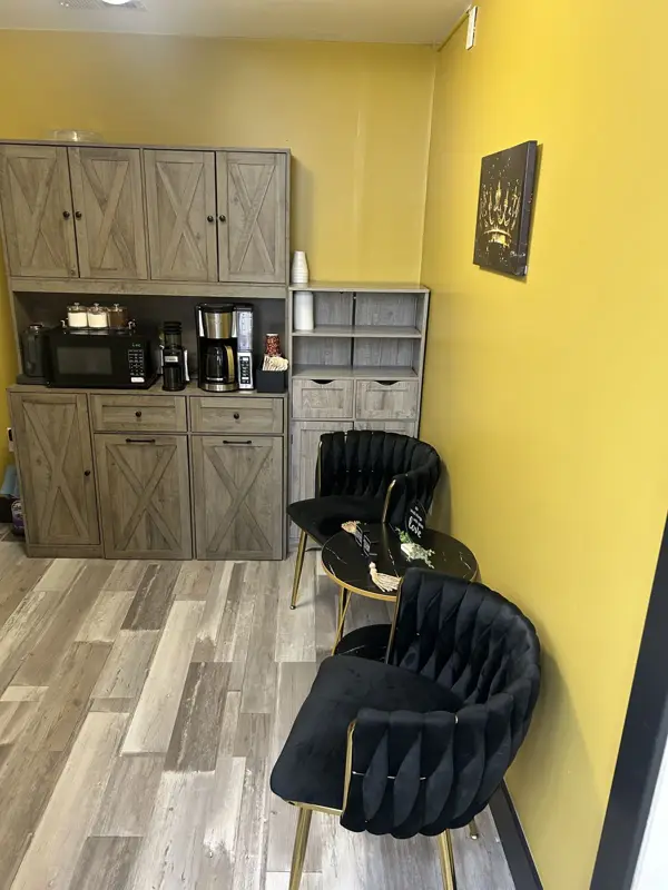 Coffee bar with coffee maker and lounge chairs